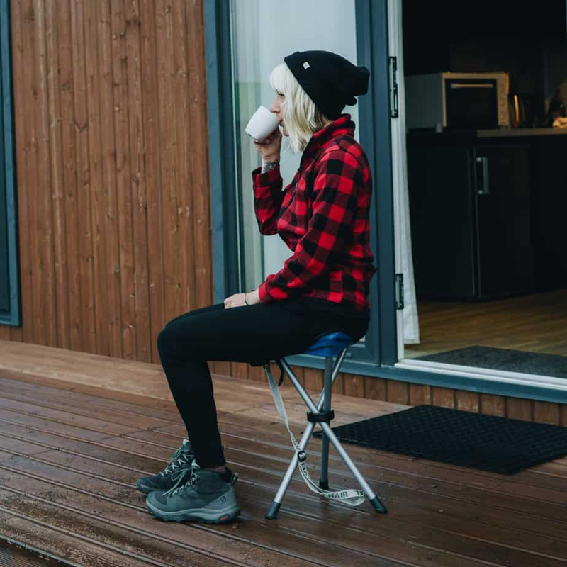 Slacker - Blue, TravelChair Slacker - Blue with model outside on deck