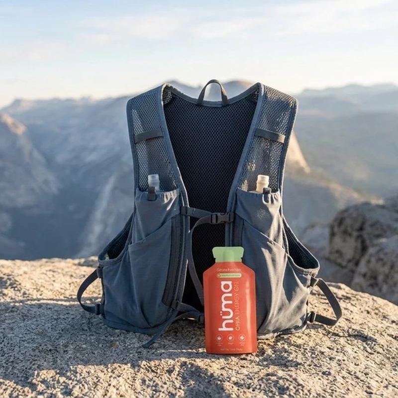 Huma Chia Energy Gel strawberry with hydration vest on rock