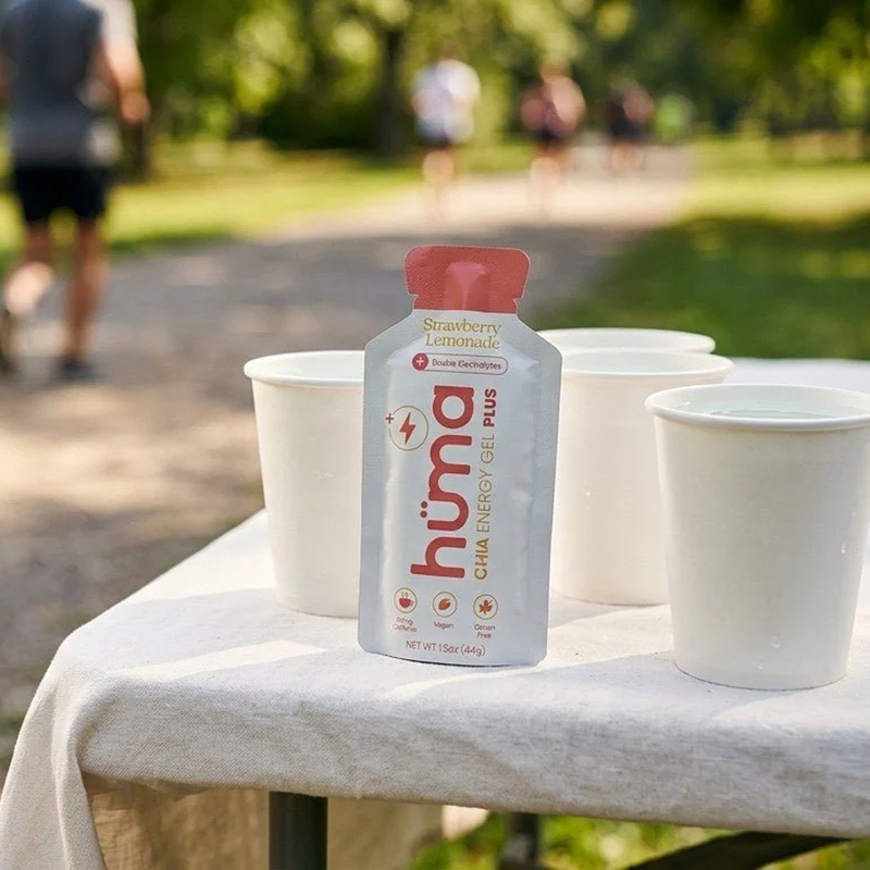 Huma Chia Gel Plus on table with paper cups for running race