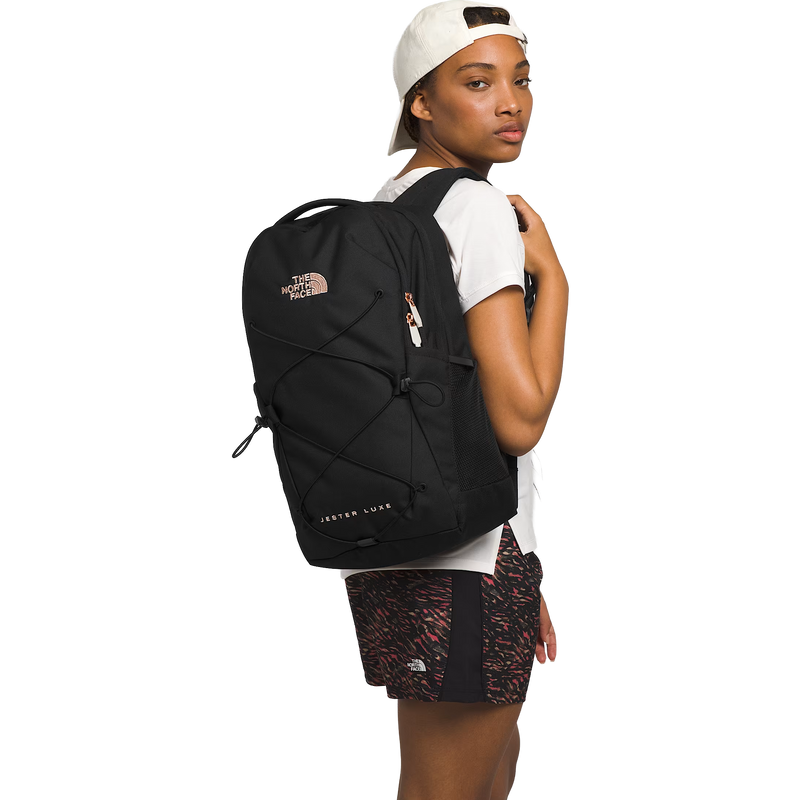 Women's Jester Luxe, The North Face Women's Jester Luxe in 7ZQ-TNF Black/Burnt Coral Metallic on model