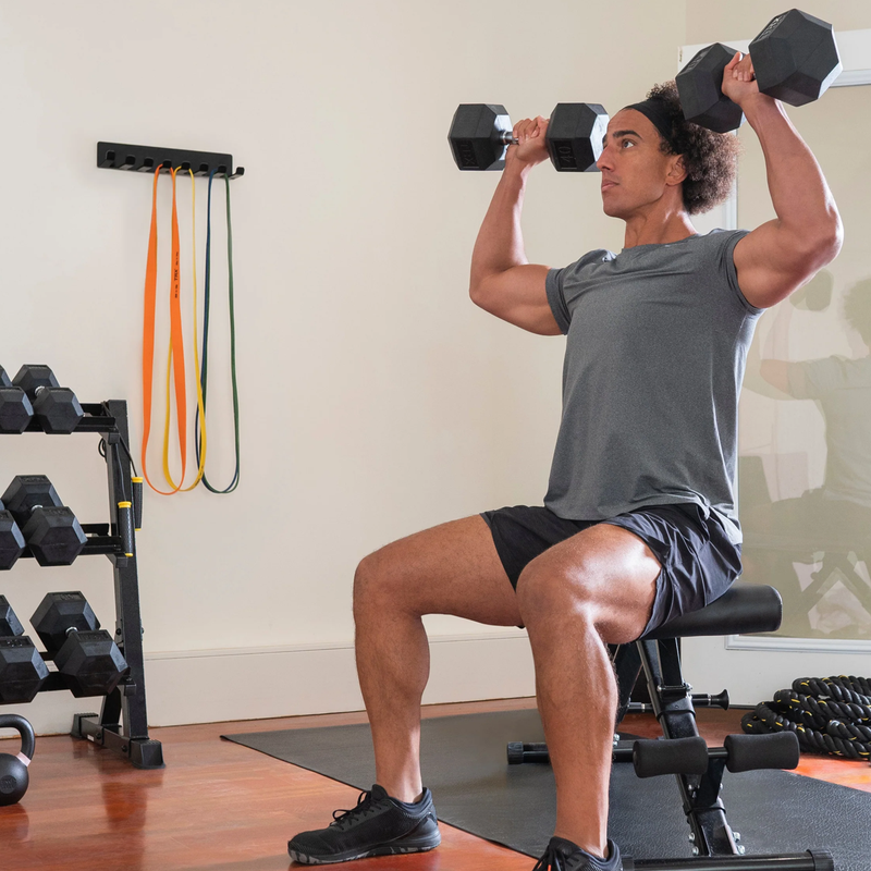 TRX Hex Rubber Dumbbell - 2.5 lb, TRX Hex Rubber Dumbbells in hand