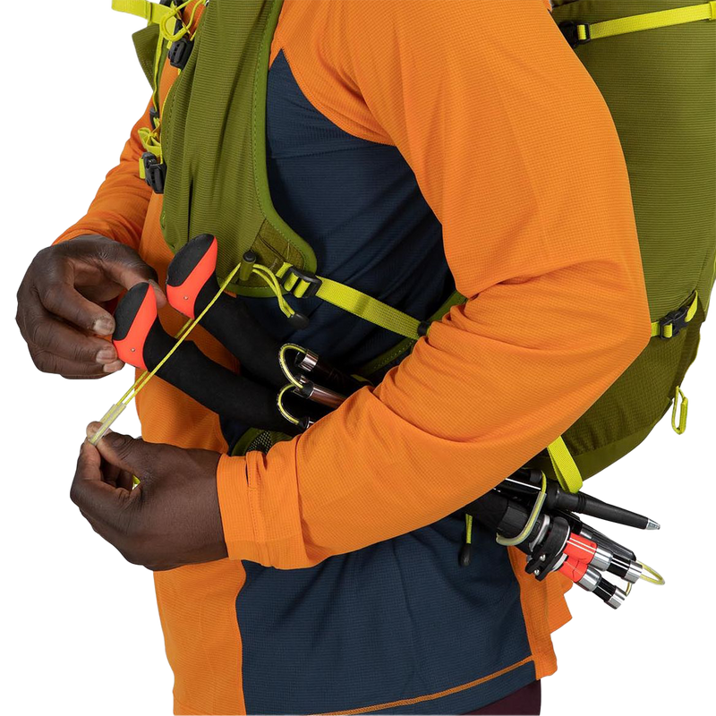 Talon Velocity 20, Osprey Talon Velocity 20 in green on model trekking pole straps