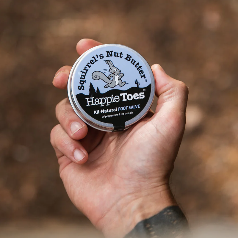 Happie Toes Tin 2 oz, Squirrel's Nut Butter Happie Toes Tin 2 oz in hand