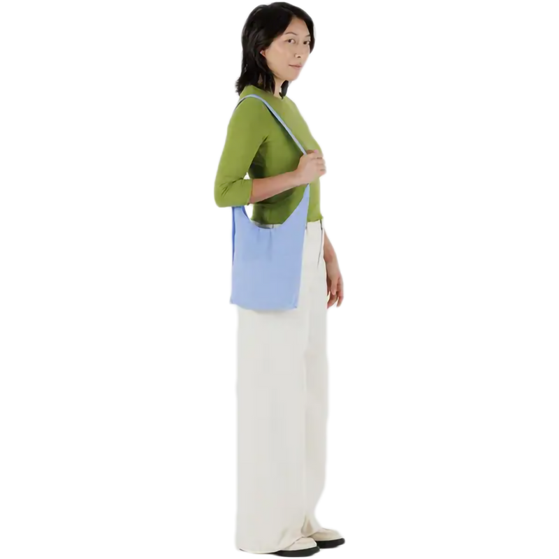 Small Nylon Sling, BAGGU Small Nylon Sling in French Blue with model right