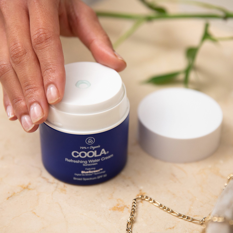 Refreshing Water Cream Organic Face Sunscreen SPF 50, COOLA Refreshing Water Cream Organic Face Sunscreen SPF 50 in hand