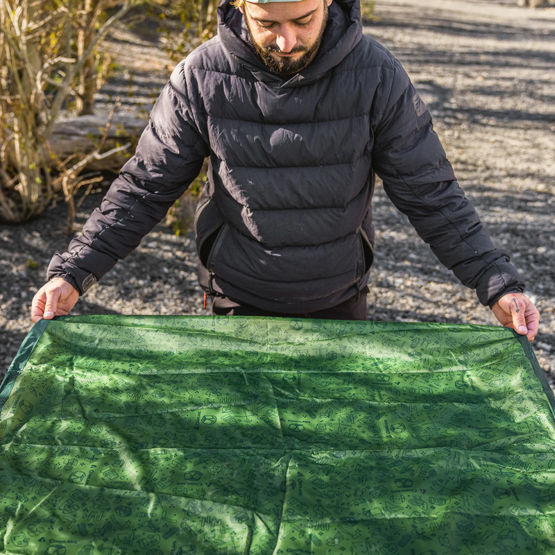 Picnic Table Cover, Coghlan's Picnic Table Cover in hand