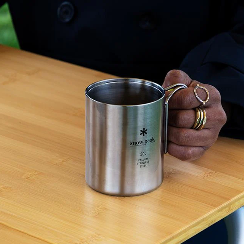 Stainless Vacuum-Insulated Mug 300, Snow Peak Stainless Vacuum-Insulated Mug 300 in hand