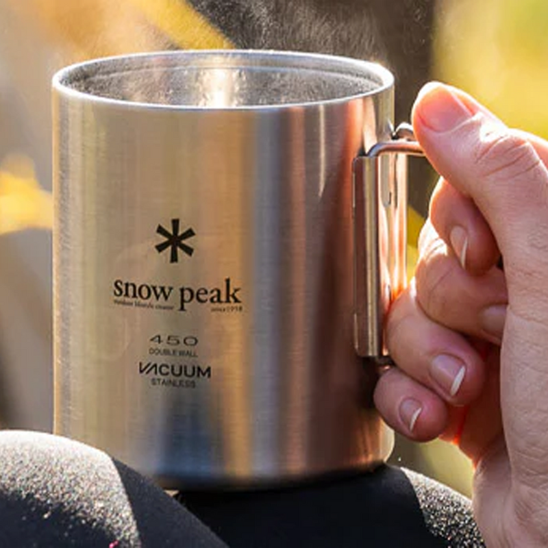 Stainless Vacuum-Insulated Mug 450, Snow Peak Stainless Vacuum-Insulated Mug 450 in hand