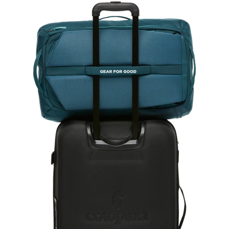 Allpa 35L Travel Pack, Cotopaxi Allpa 35L Travel Pack in Blue Spruce Abyss with luggage strap detail