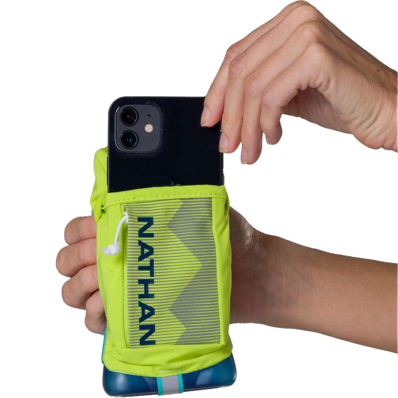 12oz QuickSqueeze Plus, Nathan 12oz QuickSqueeze in Finish Lime/Blue front phone pocket with model
