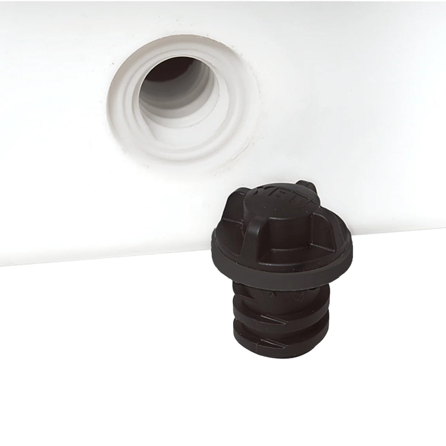 Yeti Drain Plug V2 1-Pack next to valve