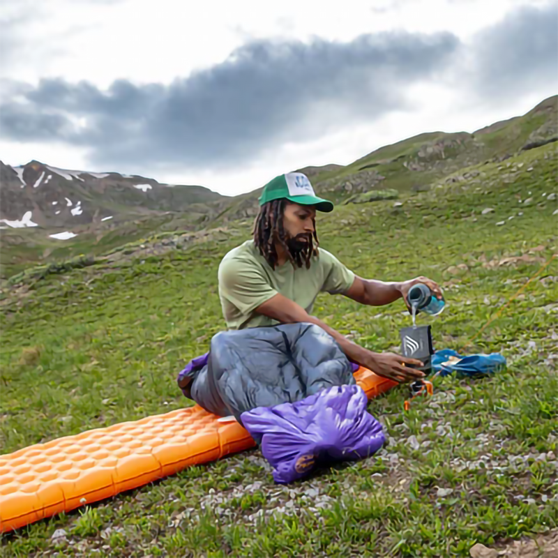 Fly Creek UL Zip Quilt 50 - Regular, Big Agnes Fly Creek UL Zip Quilt 50 in Asphalt/Royal Purple  with model outside
