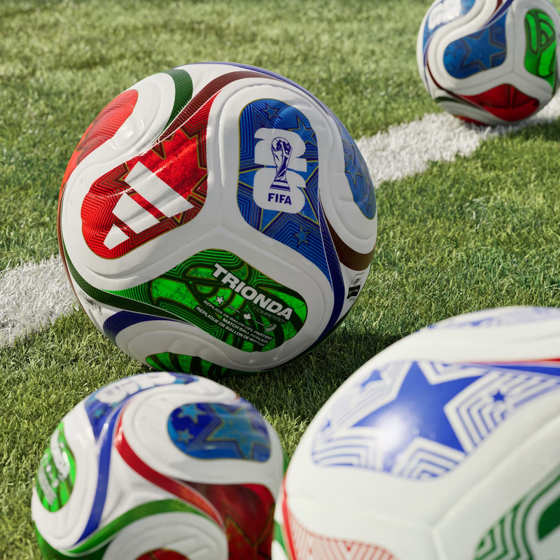 World Cup Trionda Competition Ball, Adidas World Cup Trionda Competition Ball in White/Solar Blue/Hi-Res Red/Flash Lime on grass