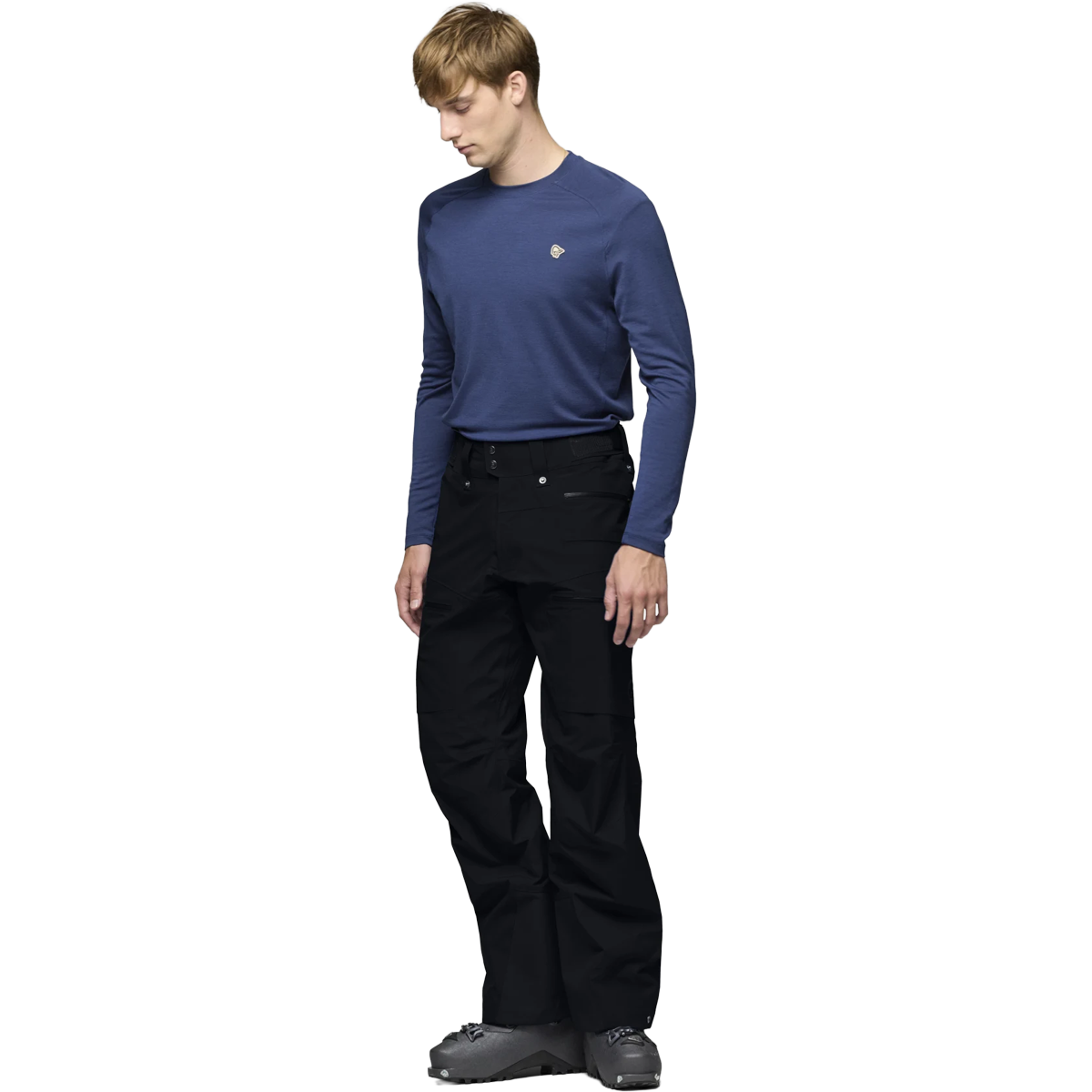Norrona Lofoten Gore-Tex Pants in Caviar Black on model with ski boots