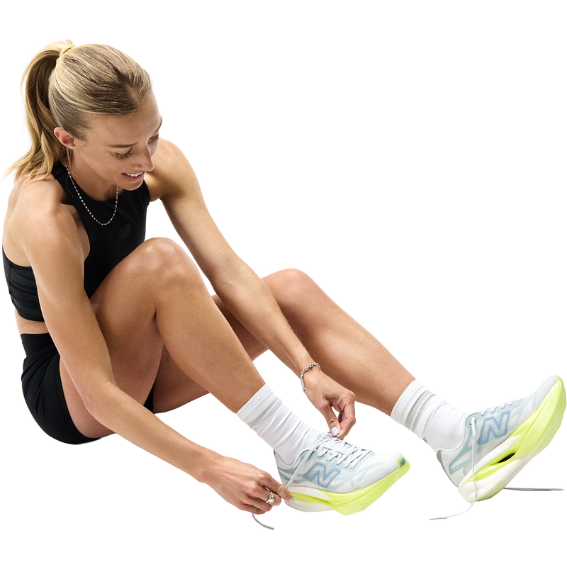 Women's SuperComp Elite v6, New Balance Women's SuperComp Elite v6 runner tying shoes