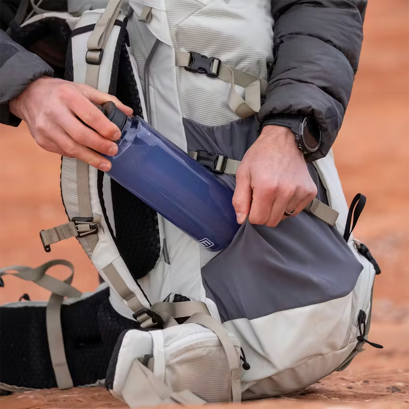 Skala 60L Backpack, Yeti Skala 60L Backpack in Ridgeline with model and bottle