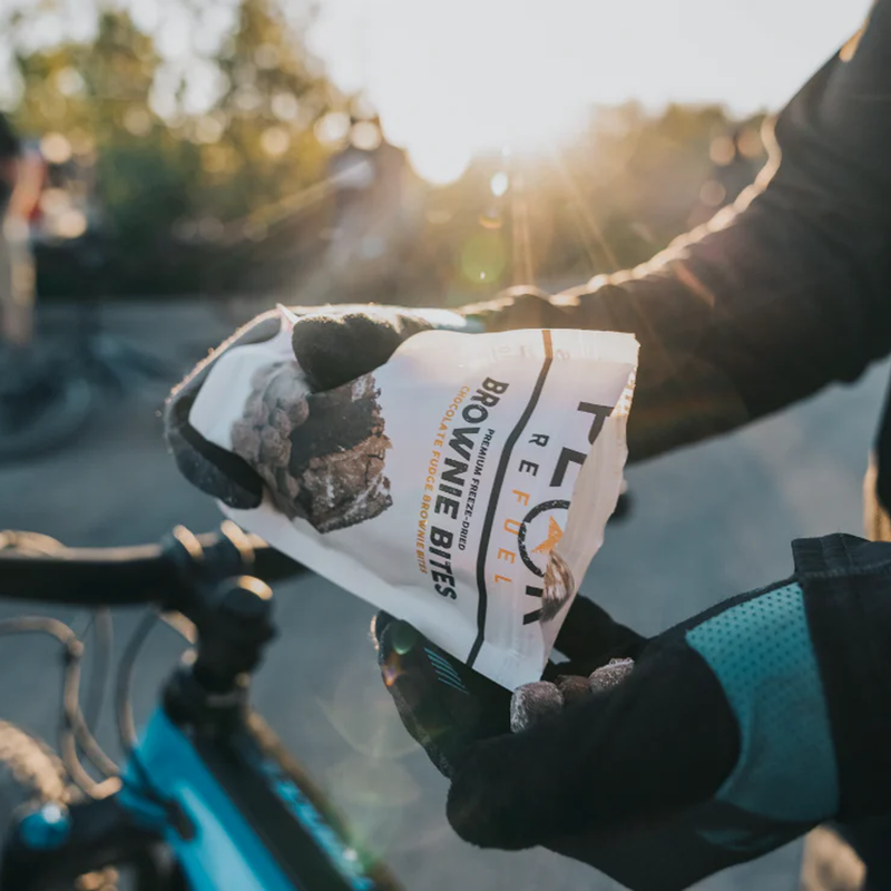Chocolate Fudge Brownie Bites (2 Servings), Peak Refuel Chocolate Fudge Brownie Bites (2 Servings) in hand