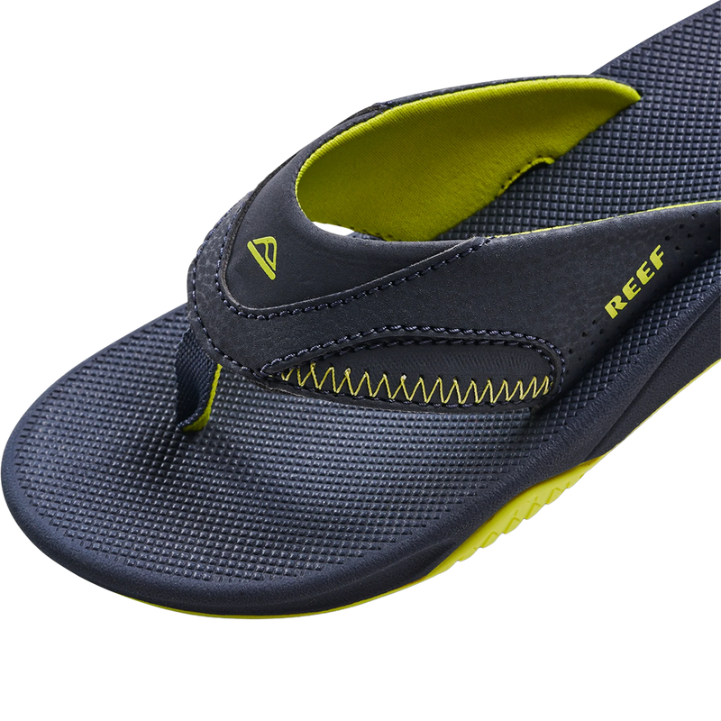 Youth Fanning, Reef Youth Fanning in Lime Navy angled  left facing with stitch and footbed detail