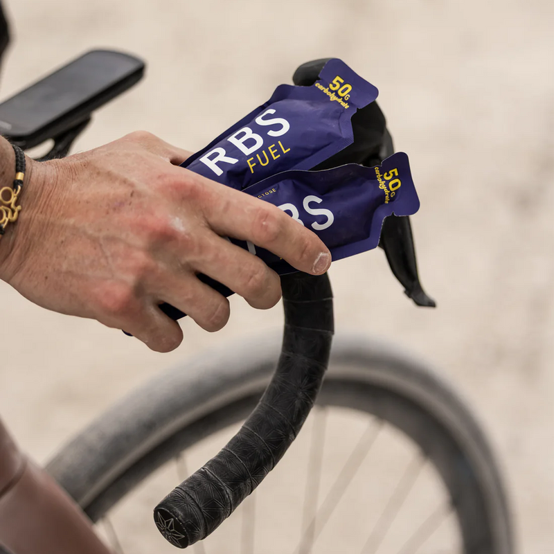 Salted Original 50g Energy Gel, Carbs Fuel Salted Original 50g Energy Gel in hand on riders handlebar