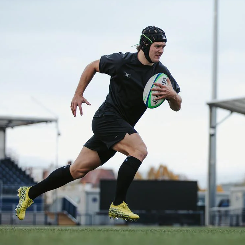 Omega Rugby Match Ball, Gilbert Omega Rugby Match Ball with player on field