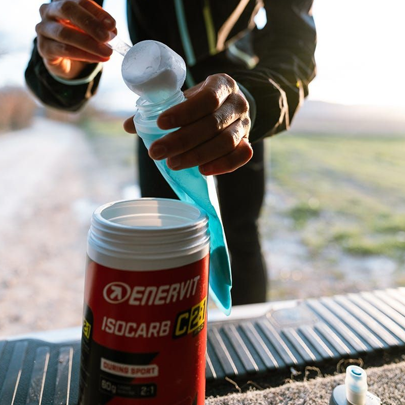 C2:1PRO Isocarb Drink Mix (16 Servings), Enervit C2 Isocarb Drink Mix being measured and scooped