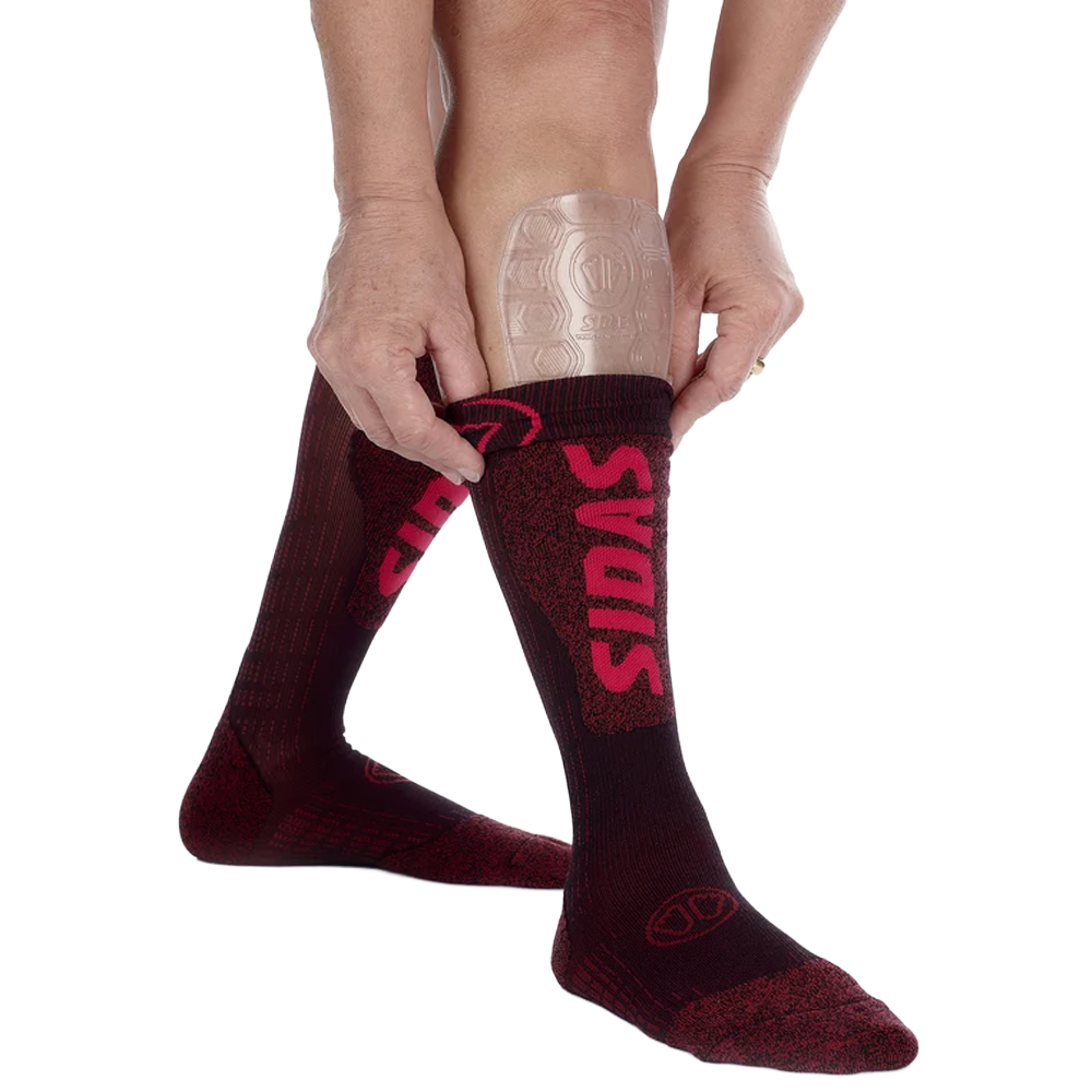 Sidas Gel Tibial Evo Shin Protector pair on shins with socks being pulled up