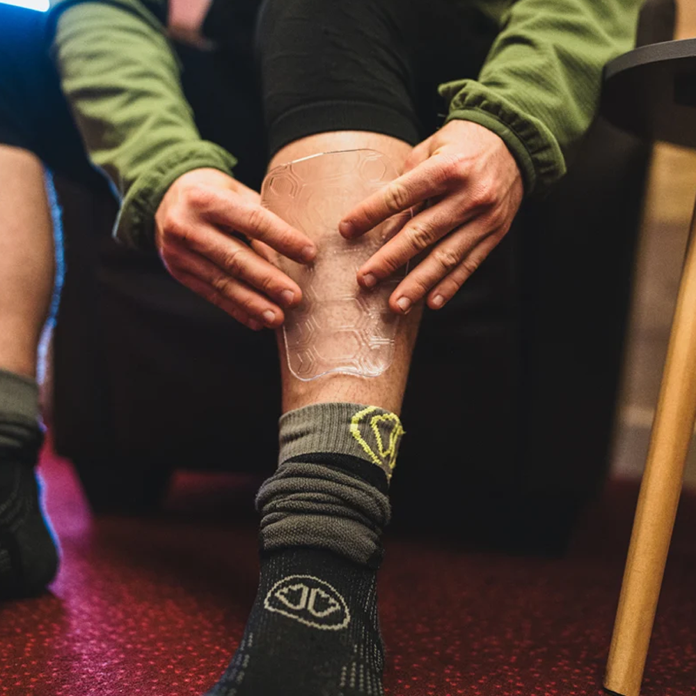 Sidas Gel Tibial Evo Shin Protector on riders shin with socks being pulled up