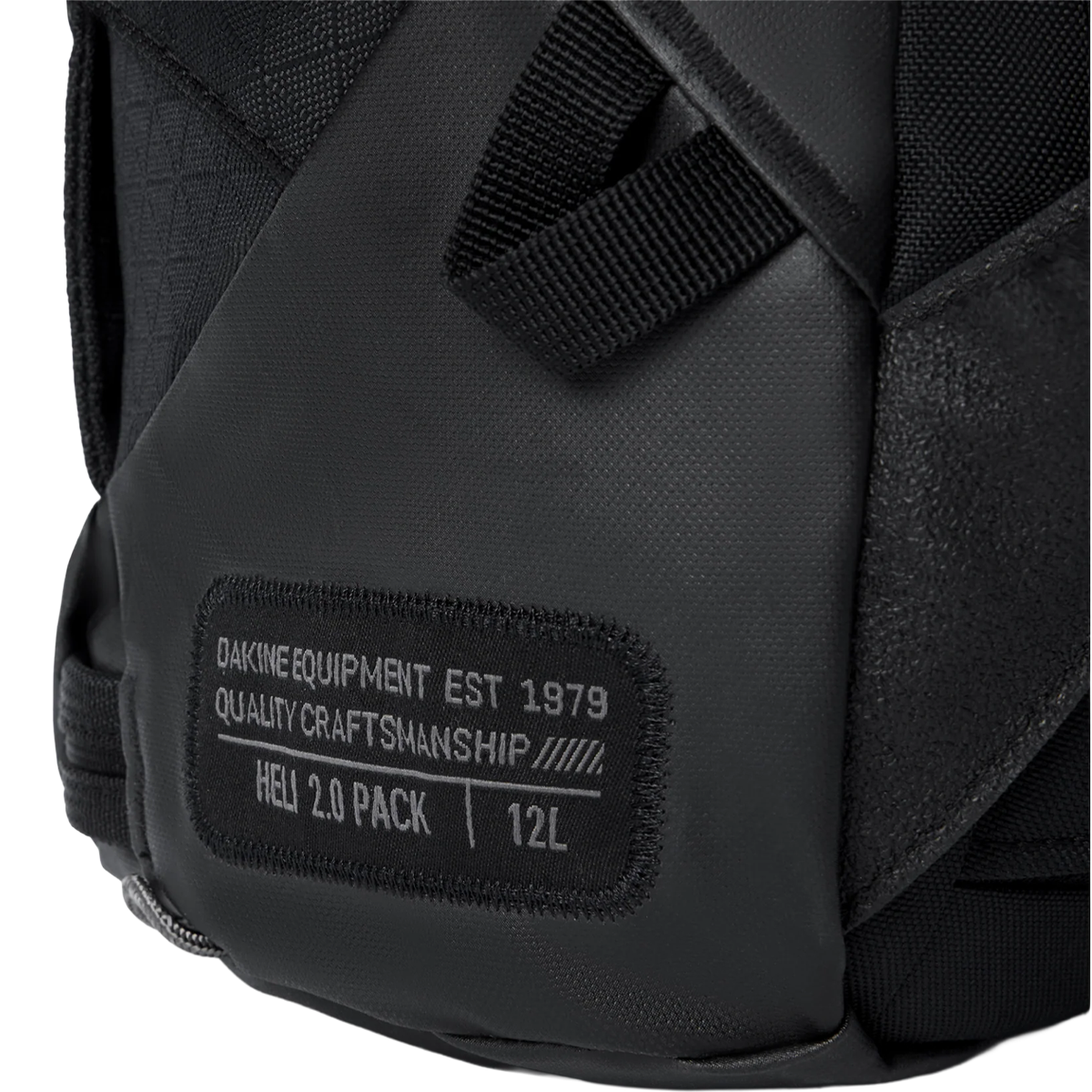 DaKine Heli 2.0 Backpack 12L in Black with logo patch detail