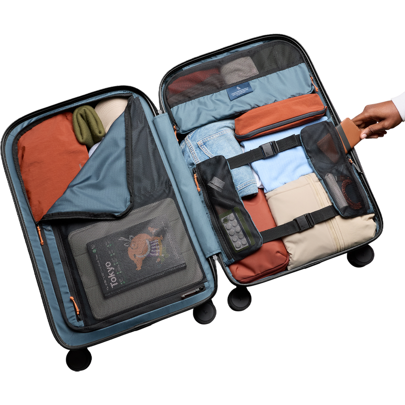 Transit Check-In, Bellroy Transit Check-In in Black opened  and filled with clothing, zipper and compartment detail