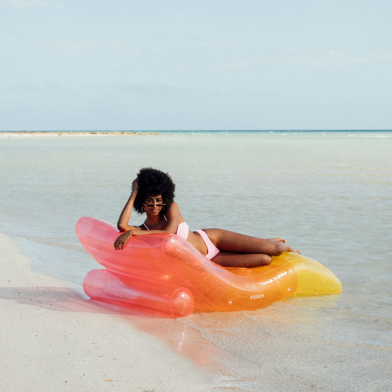 Chaise Lounger Pool Float, Funboy Chaise Lounger Pool Float in Clear Rainbow on beach with model