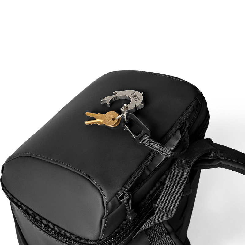 Daytrip 20L Backpack, Yeti Daytrip 20L Backpack in Black top view with zipper pocket detail and key strap with carabeaner