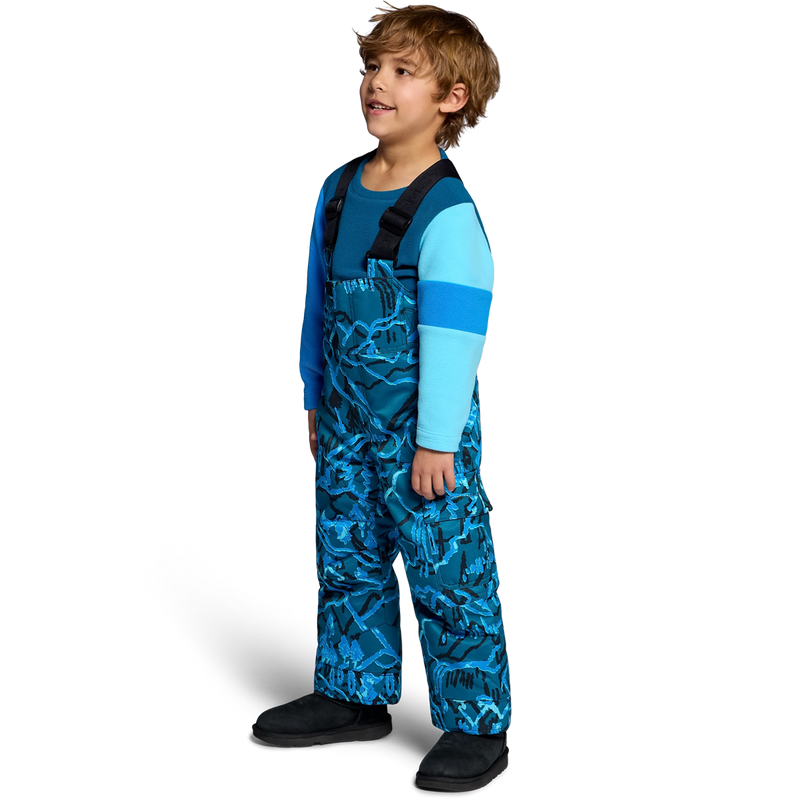 Obermeyer Youth Volt Print Bib Pant in Magic Forest angled on model