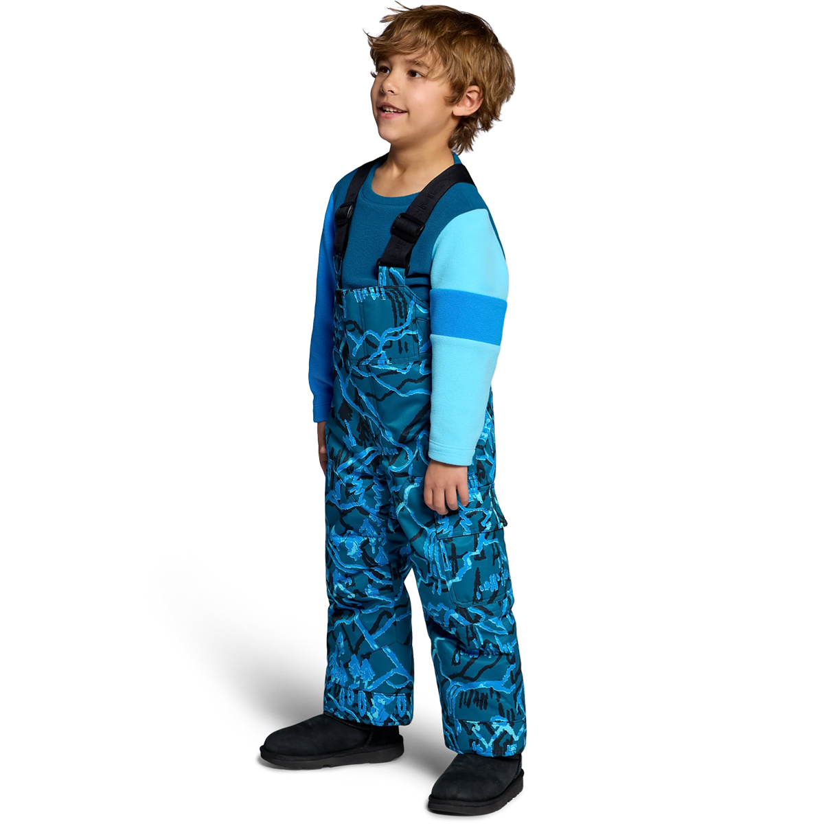 Obermeyer Youth Volt Print Bib Pant in Magic Forest angled on model