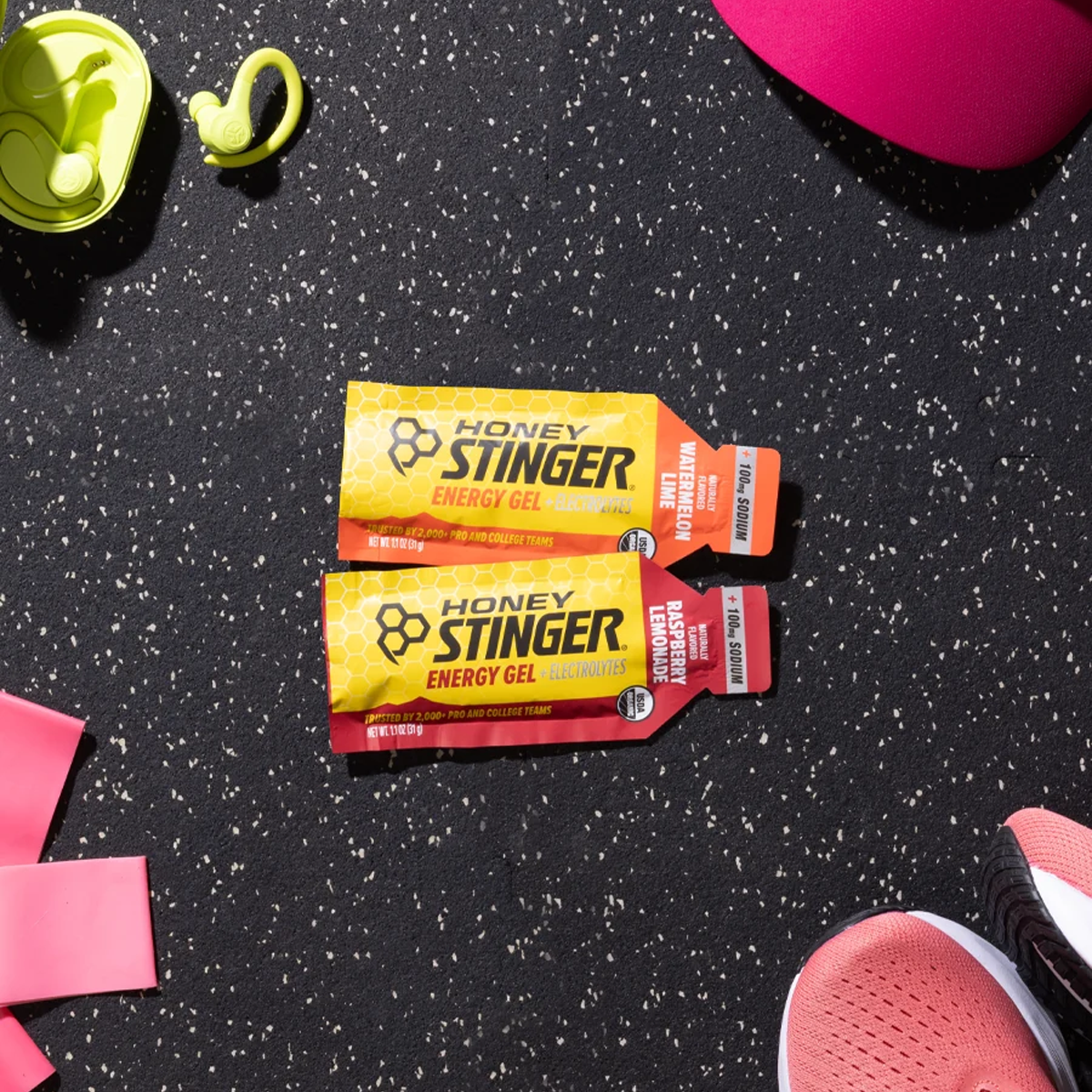 Honey Stinger Electrolyte Energy Gel s side by side on gym floor
