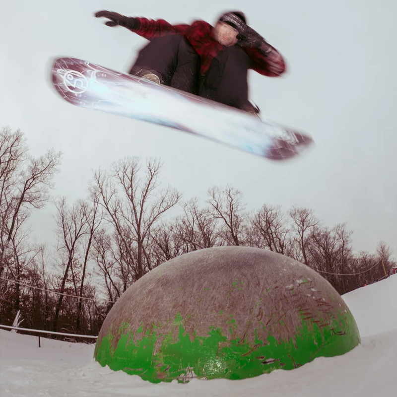 Public Snowboards PUBLIC Dispute with snowboarder jumping over a dome in park