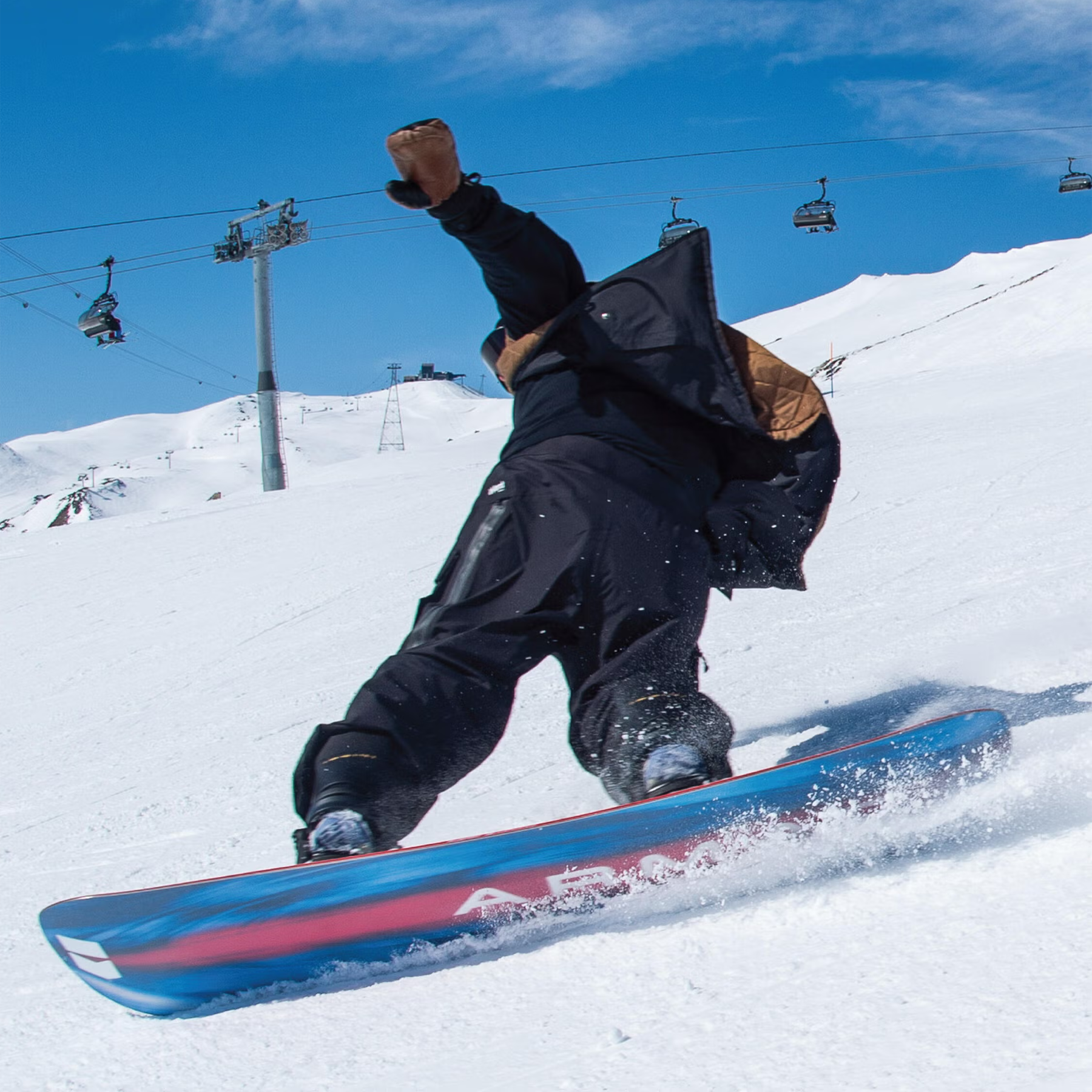 Armada Snowboards Blueprint with rider slicing downhill with snowy hill and lift in background