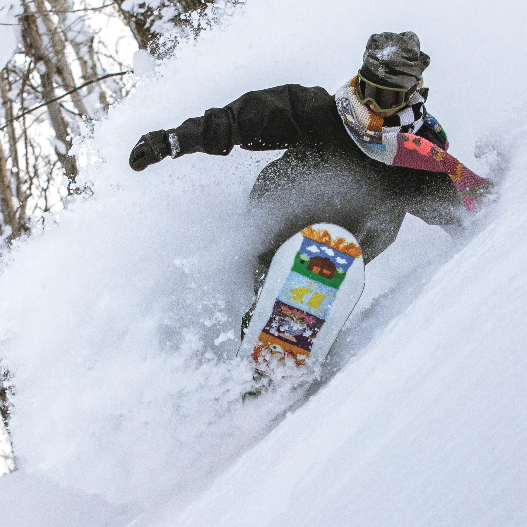 Armada Snowboards Women's Do-Si-Do with rider carving on snowy hillside
