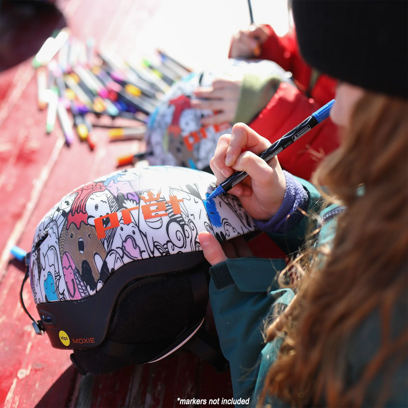 Pret Youth Moxie being colored in with paint markers by kids at table