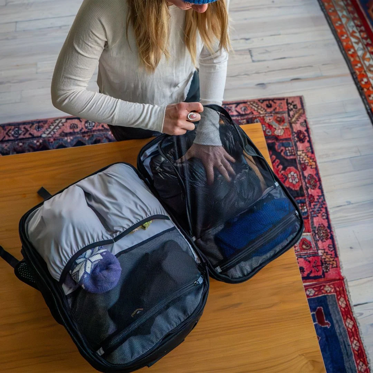 Diamant Weekend Warrior 2.0 40L woman packing utilizing the mesh packing area