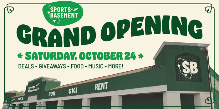 Promotional graphic for Sports Basement announcing a grand opening on Saturday, October 24. The design features a vintage-style cream sign with green borders and bold green text, alongside a graphic of the building's exterior showing green signage with a white SB logo.